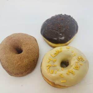 One each of Churro, Chocolate Cream-filled, and Maple Glazed donuts.