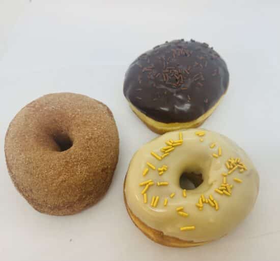 One each of Churro, Chocolate Cream-filled, and Maple Glazed donuts.