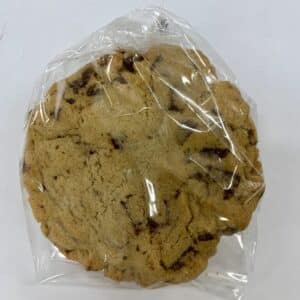 A large size chocolate chip cookie in a cello bag